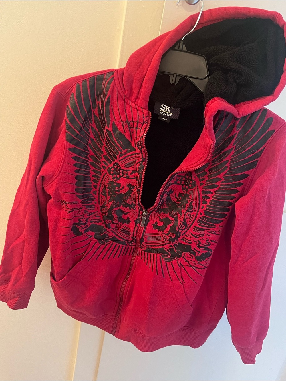 SK Apparel Red Zip Hoodie with Black Wing Graphic